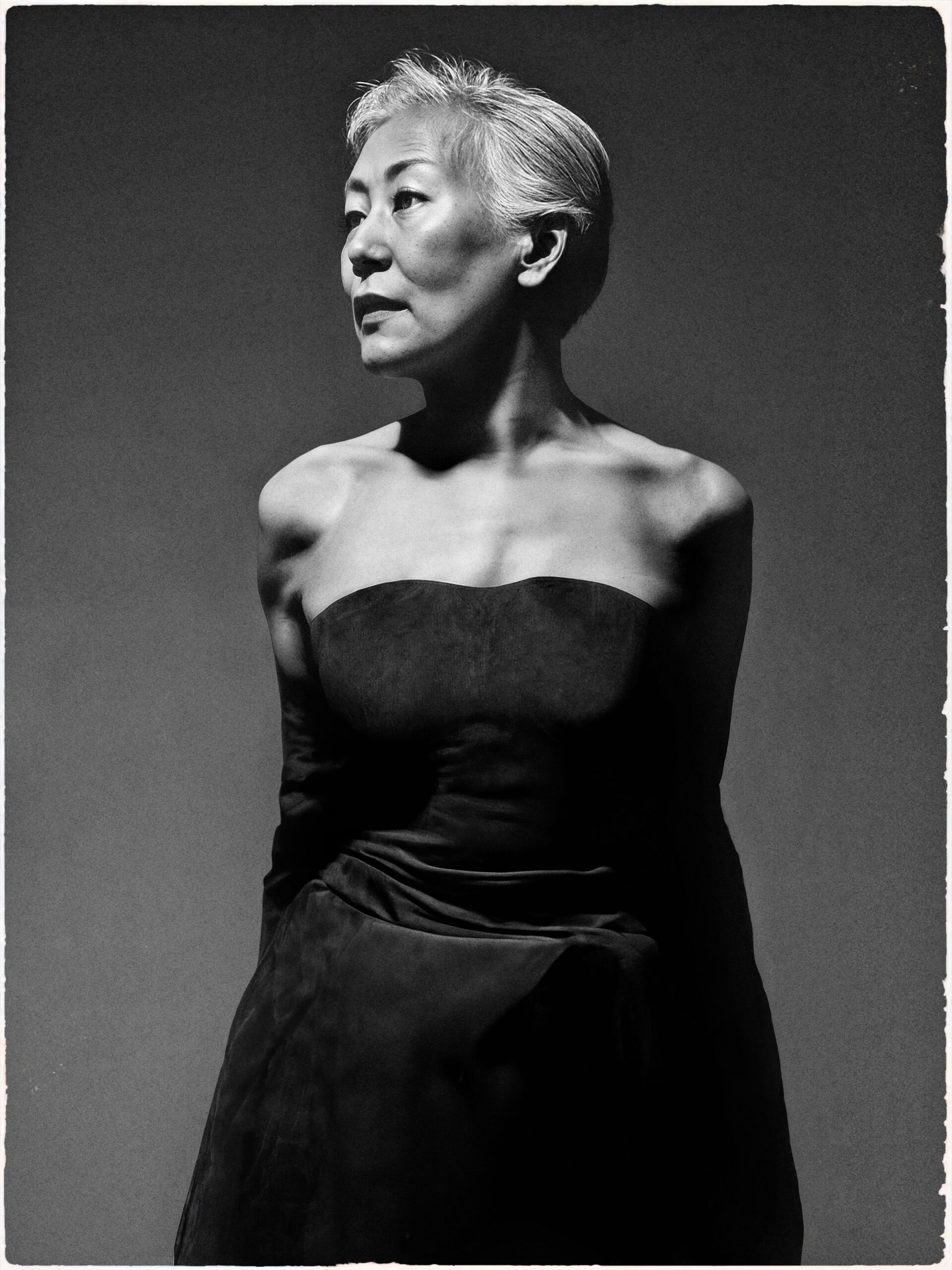 Ai generated image of a short haired model looking off camera 